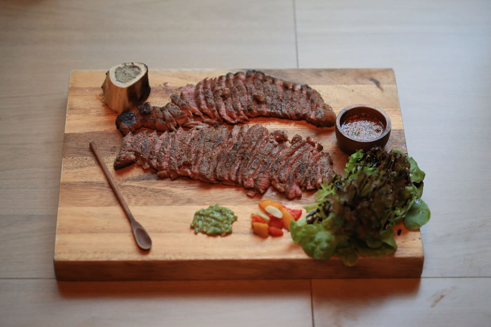 Grilled arrachera skirt steak sliced on a wood board