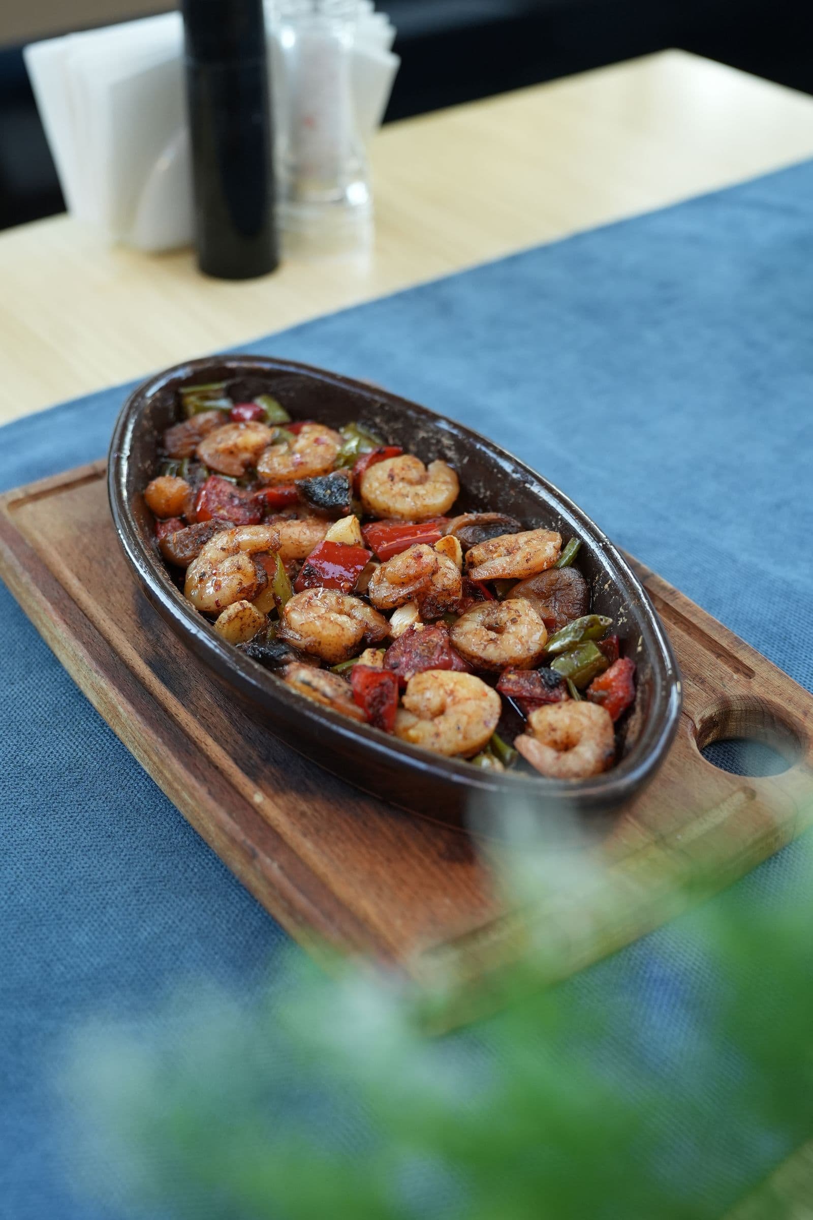 Sauteed shrimp with peppers and chorizo in a cast-iron dish