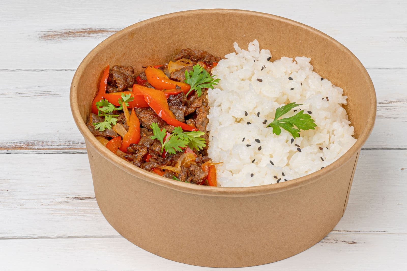 Beef fajita bowl with peppers, rice and cilantro
