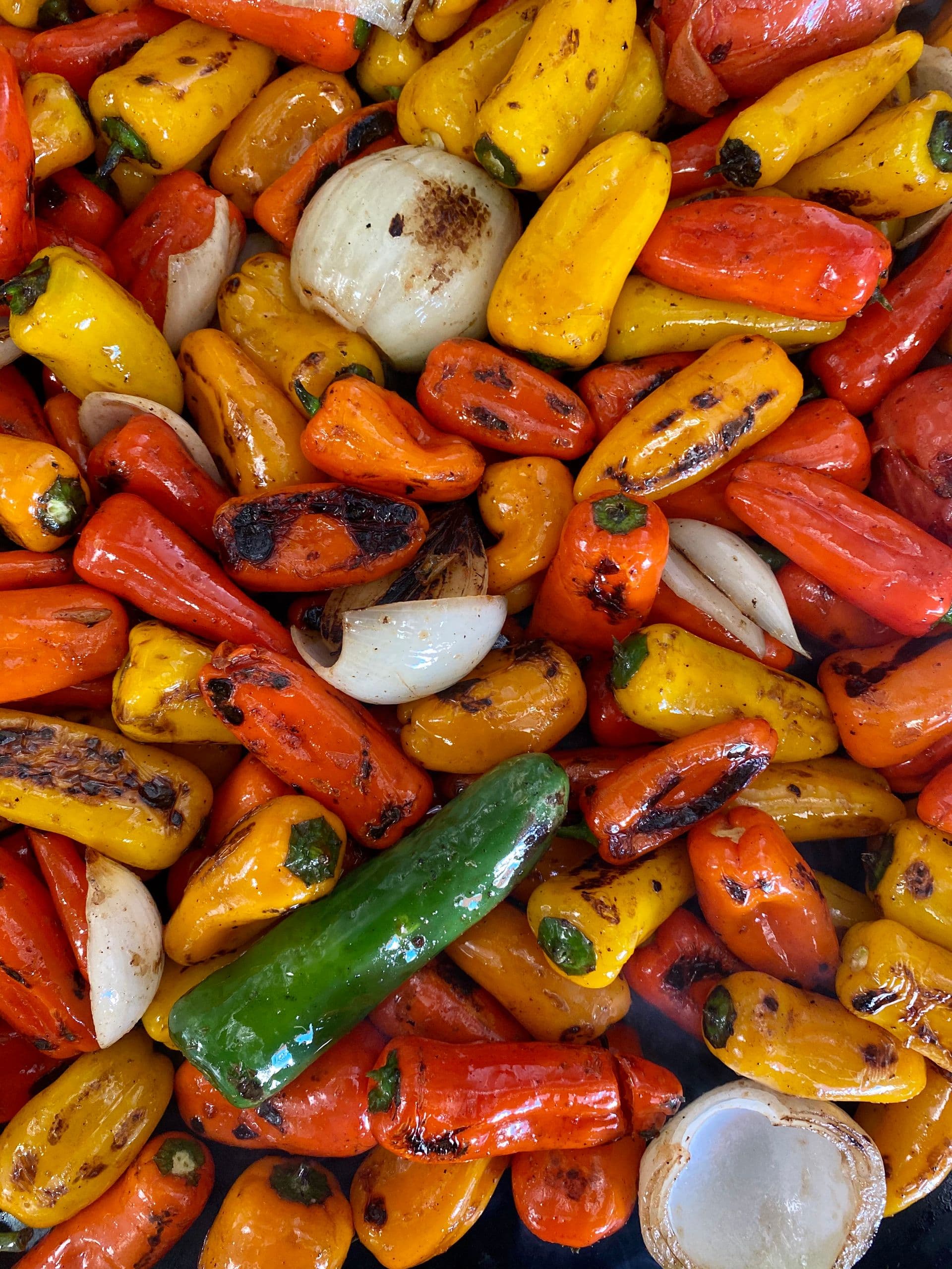 Charred grilled mini bell peppers and onions