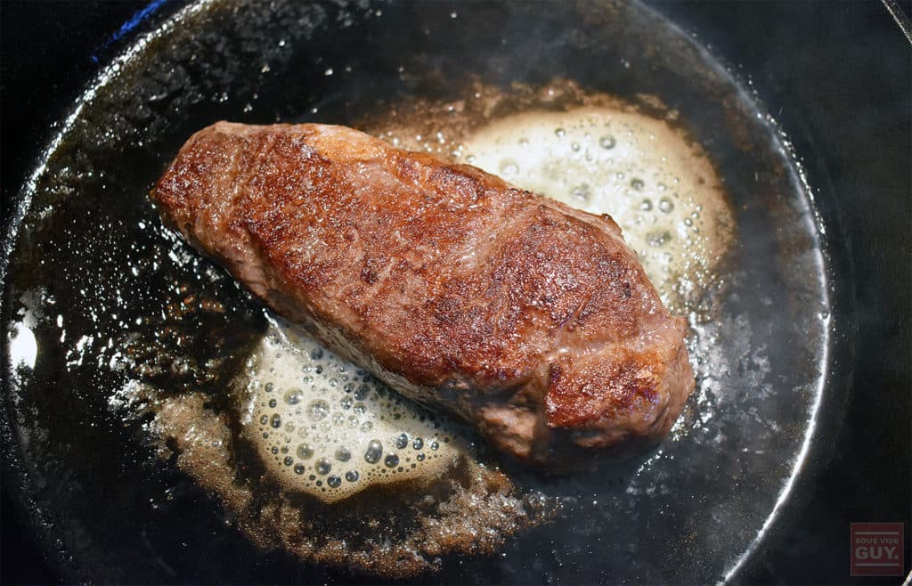 Crowd Cow seared steak in a cast iron pan
